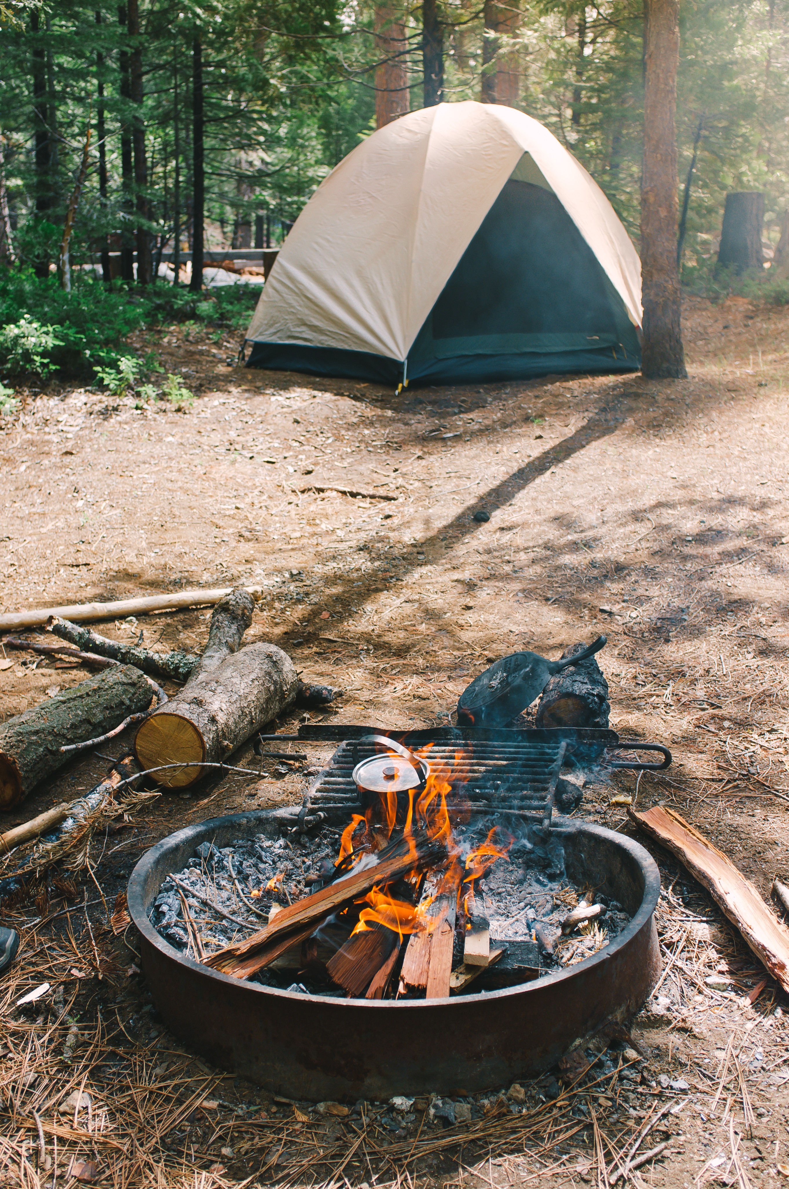 image of a tent and camp fire